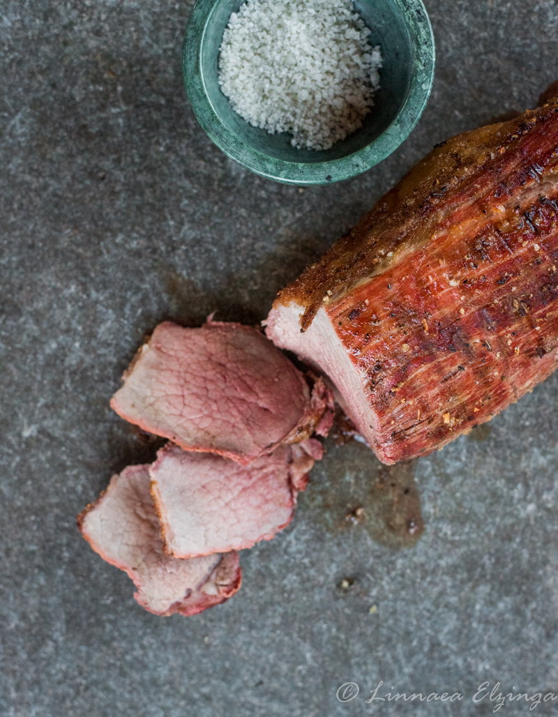 Sliced eye of the round roast with sea salt. 