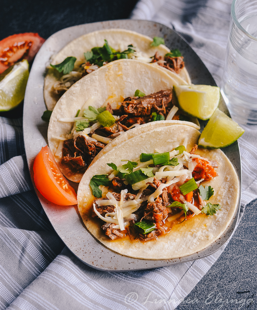 Shredded Mexican Barbacoa rump roast tacos. 